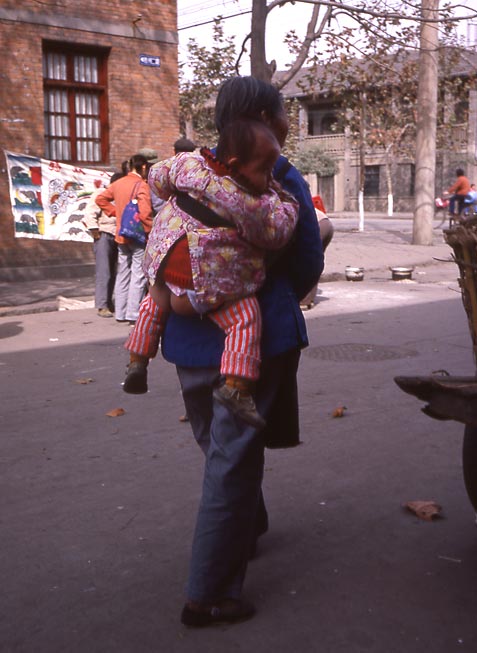 mother carry child with bare butt