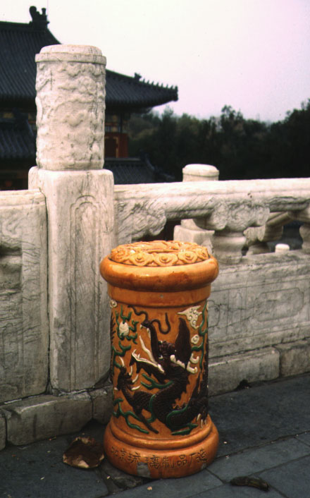 Garbage bin in China, with a dragon and ornaments