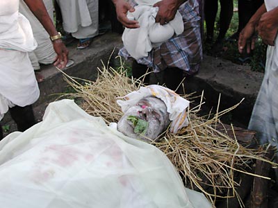 Dead man prepared for cremation, India