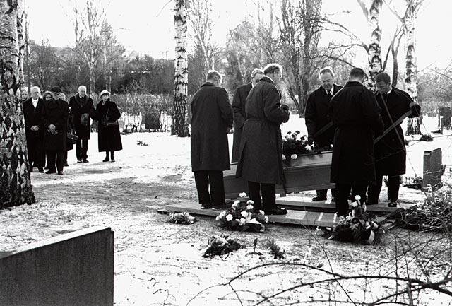 Interment of a casket in the winter with snow on the ground