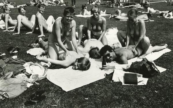 Topless girls giving massage to boyfriends