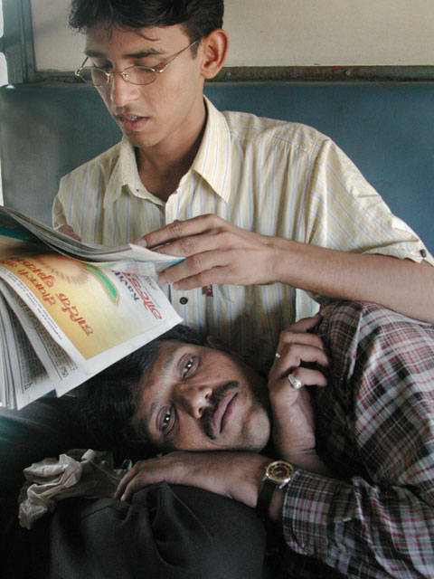 men comforting lap love hug read news paper