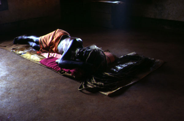 Sadhu reading a book Long hair placed on a mat Backlight