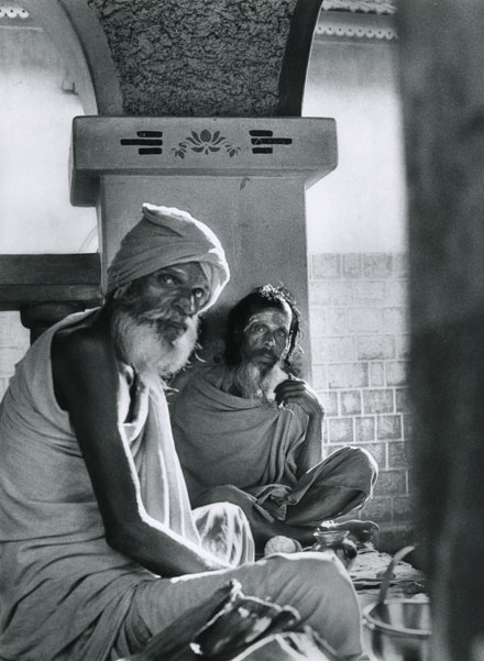 two sadhus sit outside of Shiva temple in Gokarna long hair and long beard