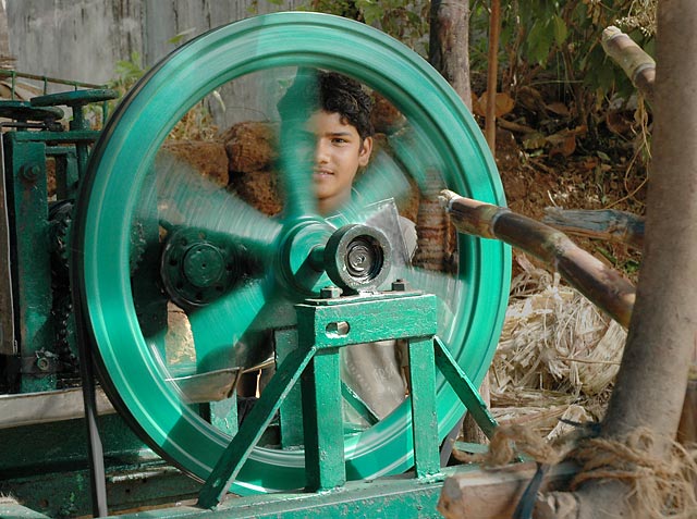 sugar cane juice young boy selling India