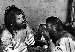 Sadhus, holy men smoking hashis in a chillum