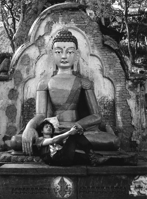 buddha with stoned man in his lap nepal kathmandu
