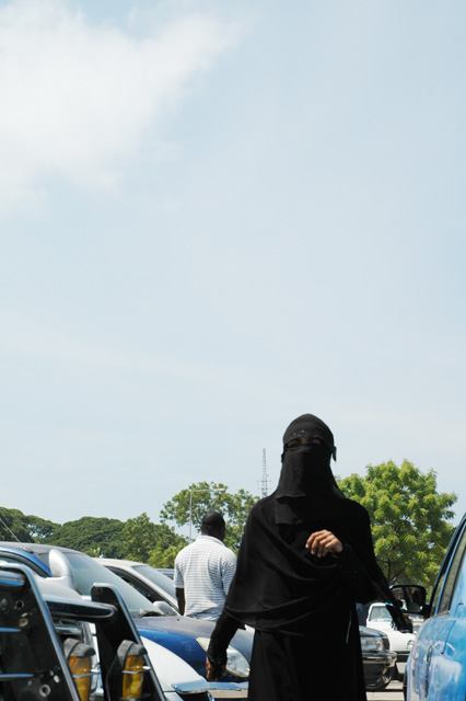 Woman in black veil Stone Town Zanzibar