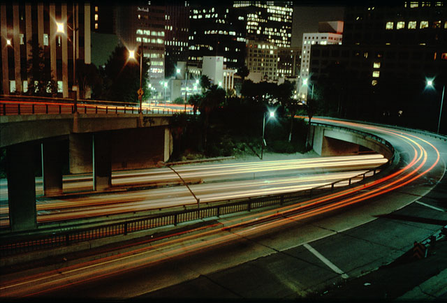 LA Los Angeles downtown by night. Long exposure, car lights leave long tracks on the film