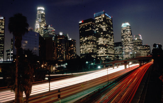 Los Angeles downtown by night. Long exposure, car lights leave long tracks on the film