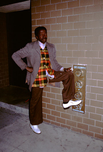 African american man in down town Los Angeles with nice white shoes and stilish clothes