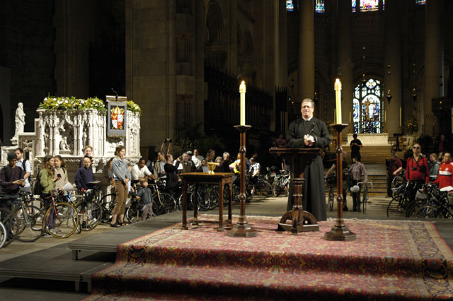 Bicycles gathered inside the church. Blessing of the Bikes at The Cathedral Church of St. John the Divine. Rev. Canon Thomas Miller