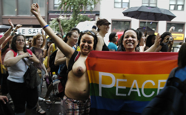 NYC dyke march Women holding a Peace flag