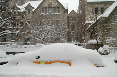 Yellow cab covered in snow New york Manhattan