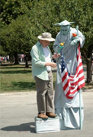 statue of liberty nyc usa flag tourist mime